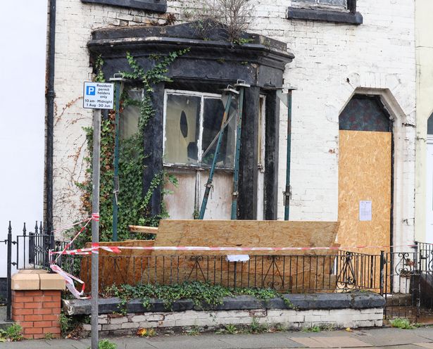Storm Amy as boards come away from an unsafe house on Walton Breck Road in Anfield