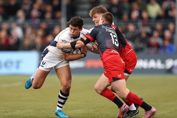 Louis Rees-Zammit of Bristol is tackled by Nick Tompkins of Saracens