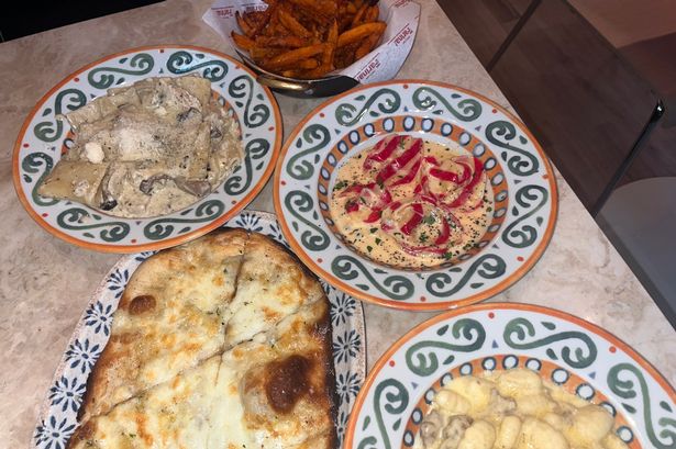 Our two main pasta dishes with the restaurant's special pumpkin dish, a side of garlic and mozzarella bread, and sweet potato fries
