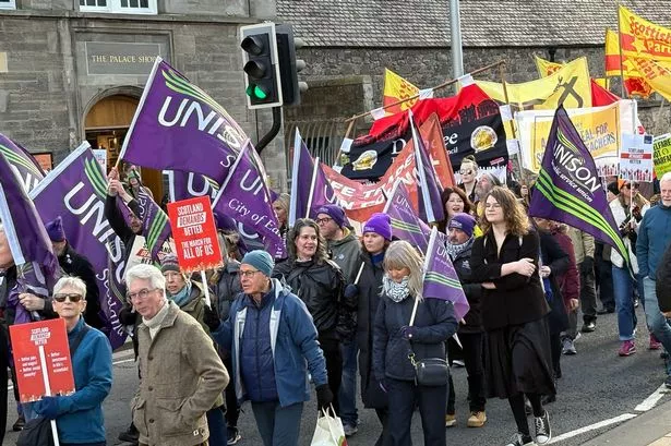 People taking part in the Scotland Demands Better March in Edinburgh