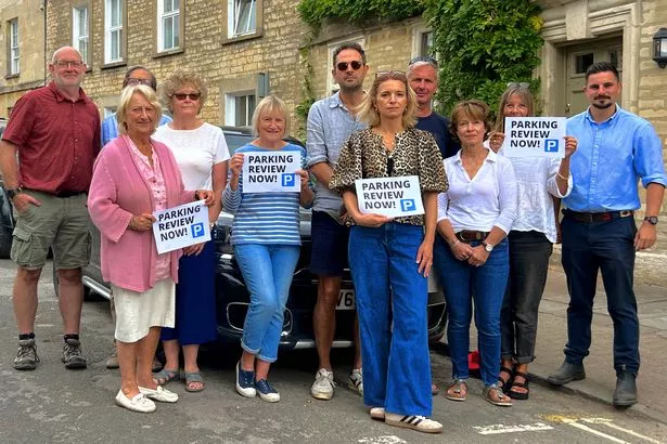 Cirencester councillor Joe Harris with residents in Gloucester Street.