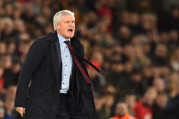 Southampton Welsh manager Mark Hughes shouts from the touchline during the English Premier League football match between Southampton and Manchester United at St Mary's Stadium in Southampton, southern England on December 1, 2018. - RESTRICTED TO EDITORIAL USE. No use with unauthorized audio, video, data, fixture lists, club/league logos or 'live' services. Online in-match use limited to 120 images. An additional 40 images may be used in extra time. No video emulation. Social media in-match use limited to 120 images. An additional 40 images may be used in extra time. No use in betting publications, games or single club/league/player publications. (Photo by Glyn KIRK / AFP) / RESTRICTED TO EDITORIAL USE. No use with unauthorized audio, video, data, fixture lists, club/league logos or 'live' services. Online in-match use limited to 120 images. An additional 40 images may be used in extra time. No video emulation. Social media in-match use limited to 120 images. An additional 40 images may be used in extra time. No use in betting publications, games or single club/league/player publications. / RESTRICTED TO EDITORIAL USE. No use with unauthorized audio, video, data, fixture lists, club/league logos or 'live' services. Online in-match use limited to 120 images. An additional 40 images may be used in extra time. No video emulation. Social media in-match use limited to 120 images. An additional 40 images may be used in extra time. No use in betting publications, games or single club/league/player publications. (Photo by GLYN KIRK/AFP via Getty Images)