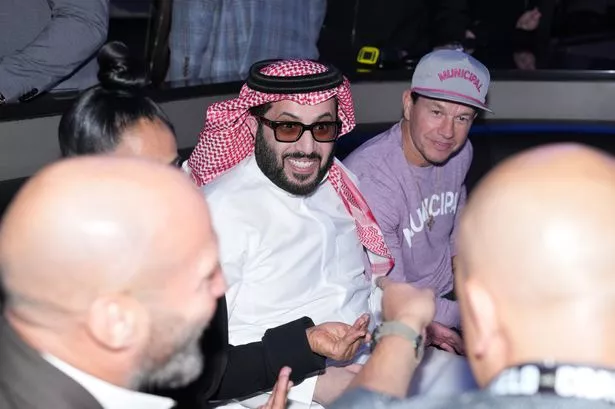 Turki bin Abdul Mohsen Al-Sheikh and Mark Wahlberg attend Netflix's Canelo v Crawford Fight Night at Allegiant Stadium.  