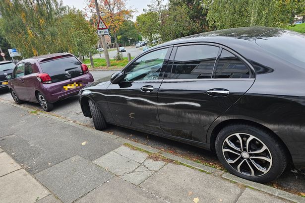 The cars spray-painted on Woolton Road in Garston