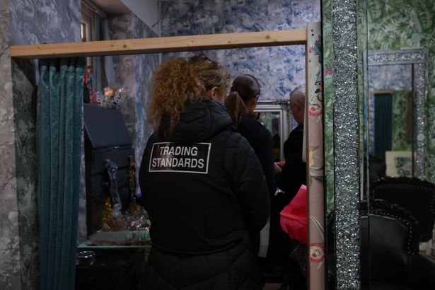 Trading standards officers inside the beauty salon 