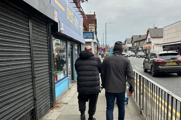 Cllr Alan Gibbons said he challenged a group of three men who were putting the flags up in Orrell Park and Walton Vale