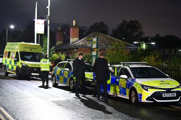 Police and ambulance at Rainhill Station