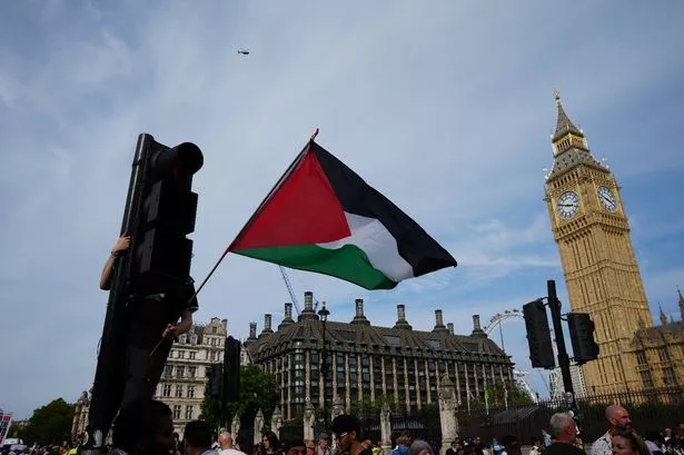 People at a Palestine Action protest in Parliament Square in London