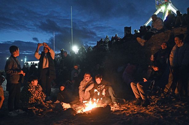 Some people lit fires on the beach for the firework display.
