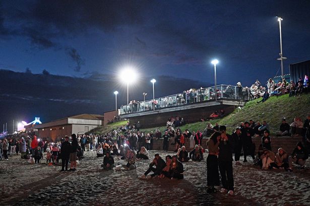 People line the sea front for the firework display