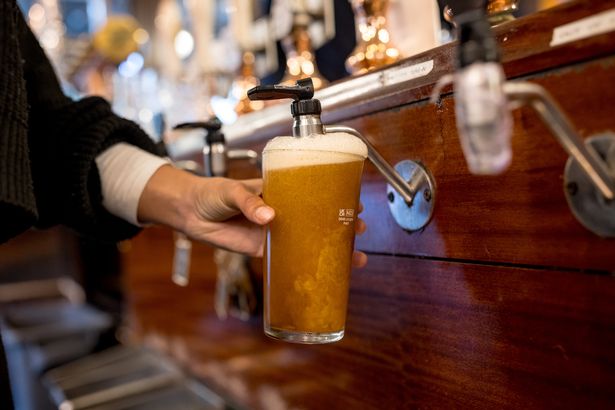 A member of the bar staff pours a pint of beer at the Westminster Arms pub on September 26, 2024 in London, England
