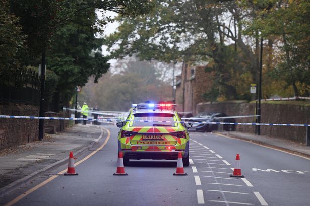 Police on Roby Road, Huyton, following a crash
