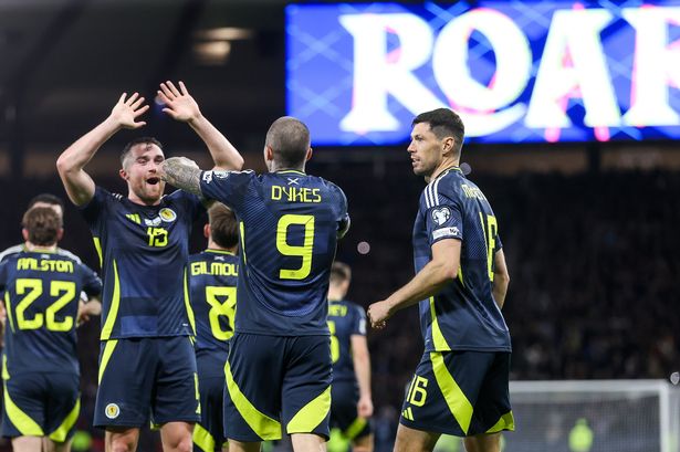 Lyndon Dykes celebrates scoring Scotland's third goal