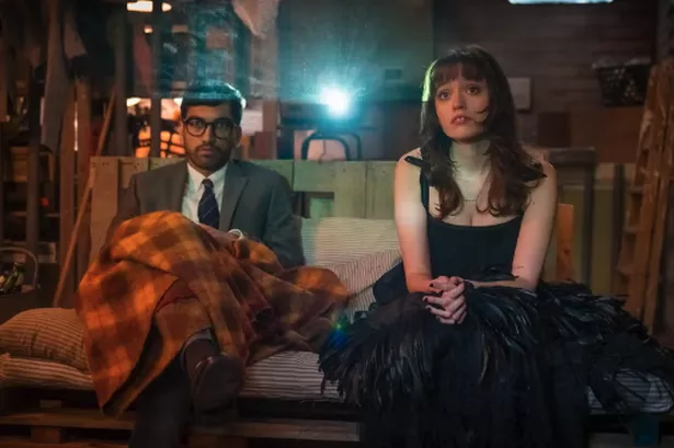 two people sat on a sofa