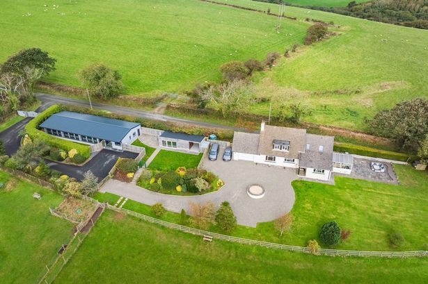 An aerial view of the Millin Brook Luxury Dog Boarding. Two seperate buildings can be seen surrounded by greenery.