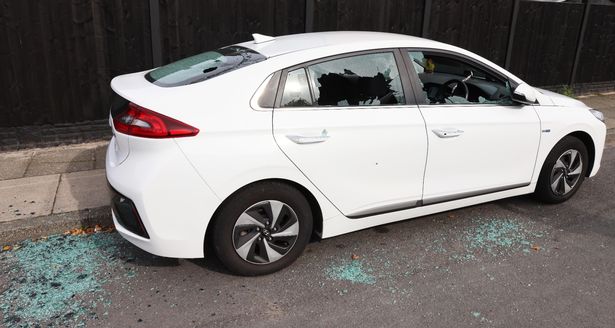 Smashed up cars parked up on Hale Road in Speke 