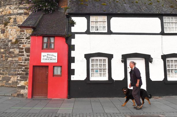 General views outside The Smallest House in Great Britain as the owners wait to receive one of Snug's new 'Small Biggie' sofas, to demonstrate the 'sofa in a box's ability to fit the most awkward of spaces, in Conwy, North Wales. Picture date: Friday August 13, 2021. PA Photo. The Smallest House in Great Britain, which measures just 72 inches wide has been given an interior makeover, including its first sofa in over 400 years. Photo credit should read: Anthony Devlin/PA Wire