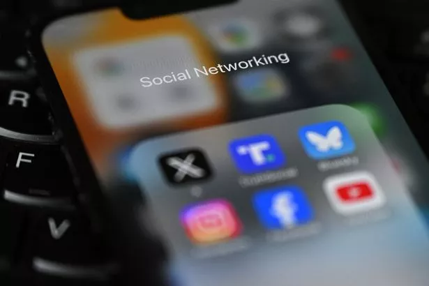 An illustration photograph taken on February 20, 2025 shows social networking apps displayed on a phone screen, in a residential property in Guildford, south of London.