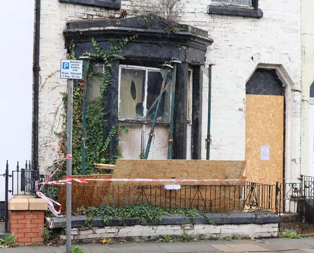 Boards have ripped away from an "unsafe house" on Walton Breck Road in Anfield amid Storm Amy