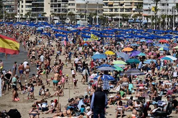  Holidaymakers crowd Levante Beach in Benidorm on April 8, 2023