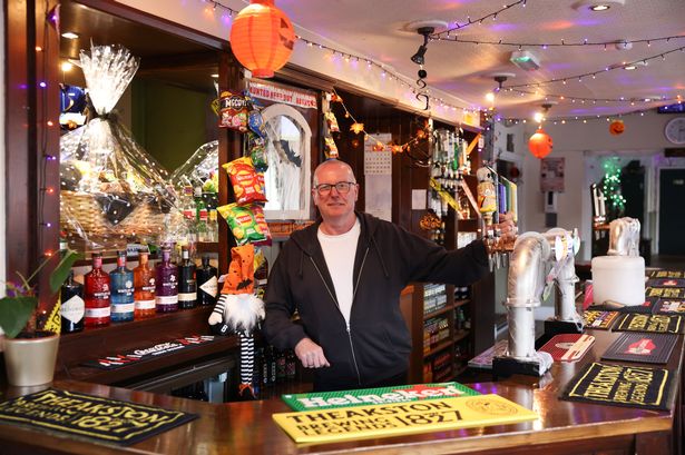 Landlord Dean Barrett behind the bar in The Coburg pub on Stanhope Street