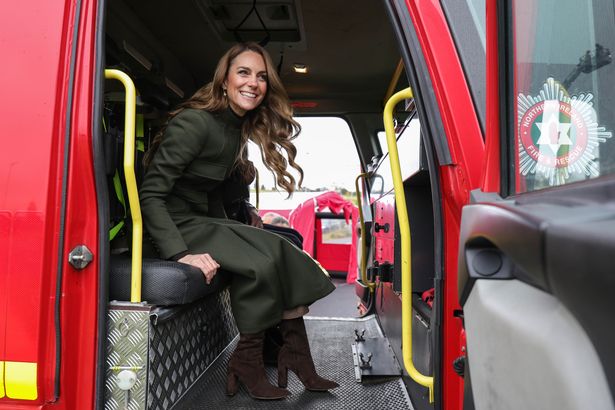The Princess of Wales sits in a fire engine on a trip to Northern Ireland
