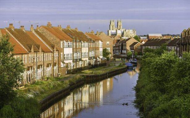 The minster, town houses, and the beck, Beverley, Yorkshire, UK.