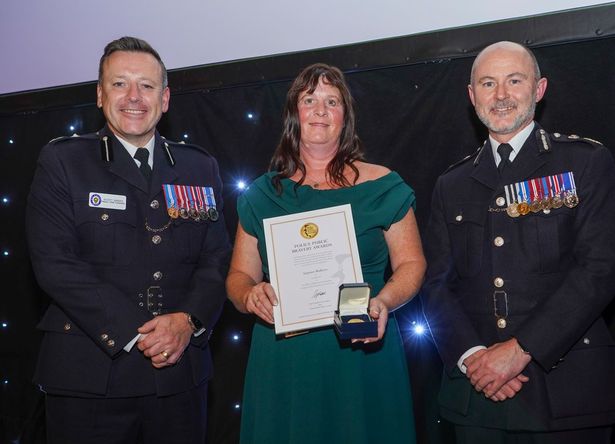 Post Office worker Gaynor Walters received her gold medal (pictured receiving it at the ceremony) at the National Police Chiefs’ Council’s annual Police Public Bravery Awards after frogmarching a knifeman out of her branch in Wolverhampton