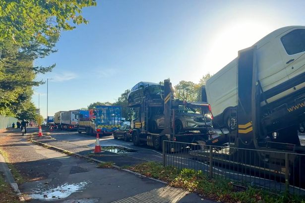 Traffic build up on the A5036 near the crossing to Our Lady Of Walsingham R C Primary School 