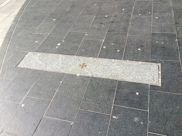 The cross marking the site of St Peter's Church in Church Street