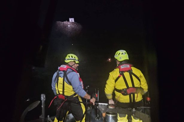 Two RNLI officers on a boat