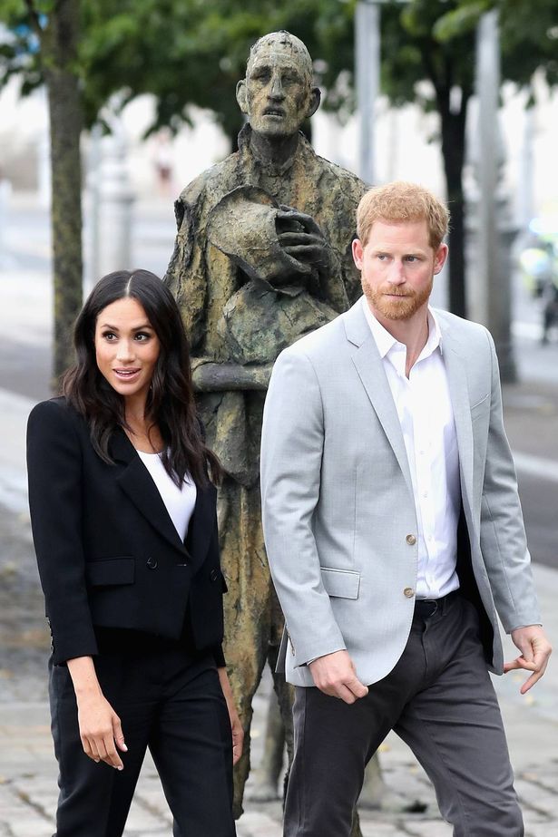 Prince Harry and Meghan Markle walking by Famine Memorial on visit to Dublin in 2018