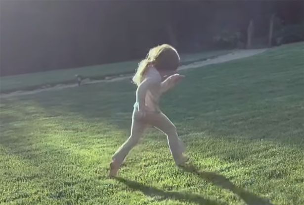Meghan shared a photo of Lilibet running through the grass in her pajamas