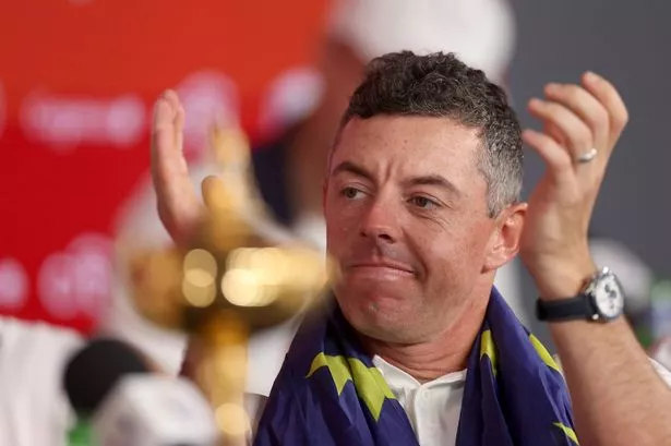 Rory McIlroy of Team Europe is interviewed during a press conference after Team Europe defeated Team United States 15-13 during the Sunday singles matches of the 2025 Ryder Cup at Black Course at Bethpage State Park Golf Course on September 28, 2025 in Farmingdale, New York