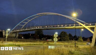 Blue and yellow lights on the bridge over the A52