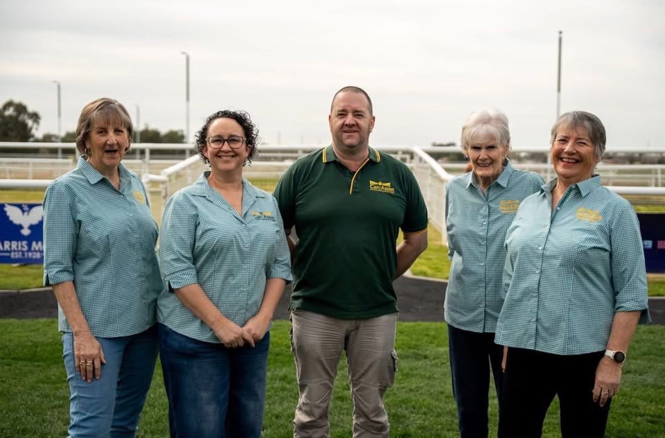 group of people at a horse-racing track