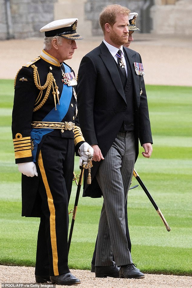 Prince Harry could see his father for the first time in more than a year and a half when they are both in London on Wednesday. Pictured: King Charles III (L) walks with Prince Harry as they arrive at St George's Chapel inside Windsor Castle on September 19, 2022, ahead of the Committal Service for Britain's Queen Elizabeth II
