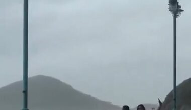 This is the terrifying moment two women and a child were swept aside by powerful sea waves as they posed for photos during Typhoon Ragasa
