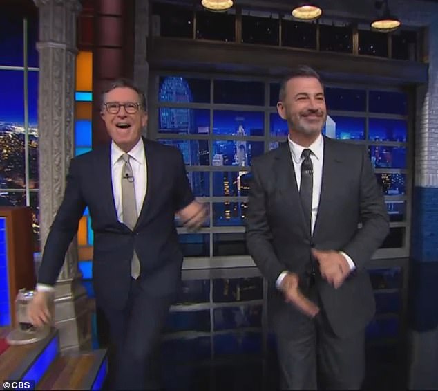 Jimmy Kimmel (right) moaned about his talk show's brief suspension while appearing on his friend Stephen Colbert's (left) show Tuesday night