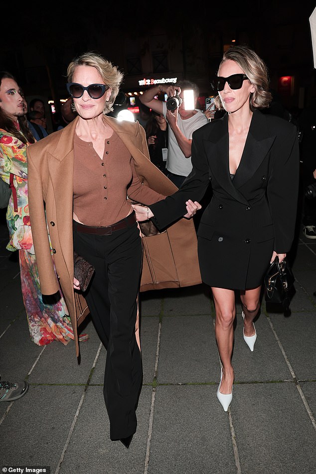 The pair looked the spitting image of one another as they held hands while departing the runway show