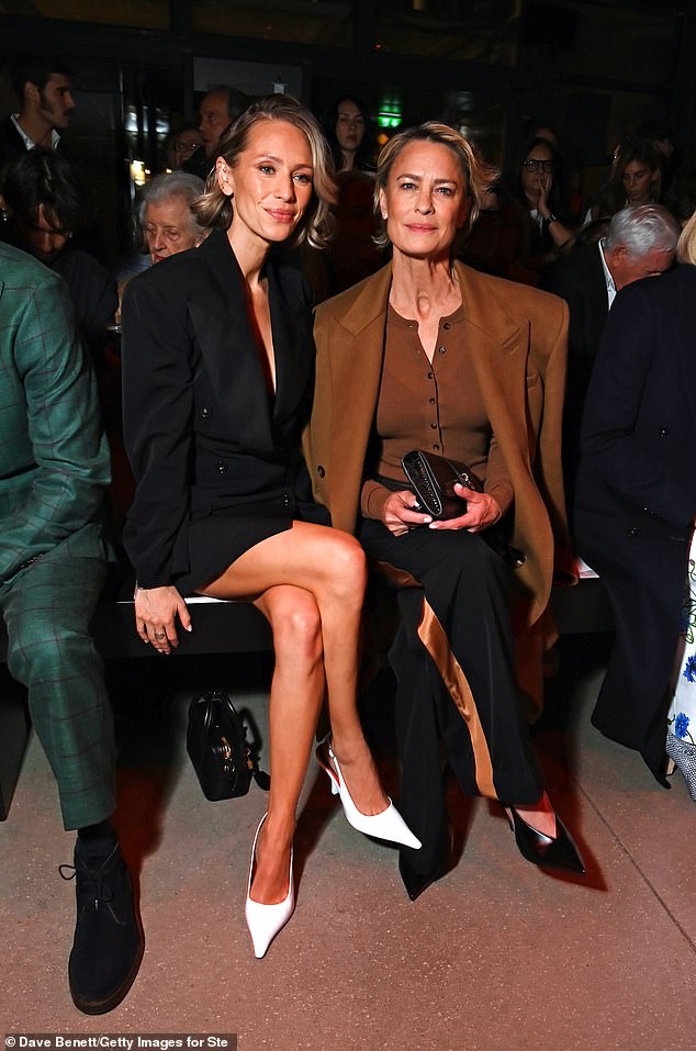 Robin Wright, 59, (R) and her lookalike daughter Dylan Penn, 34, (L) enjoyed a night out together at Stella McCartney's Paris Fashion Week show on Tuesday