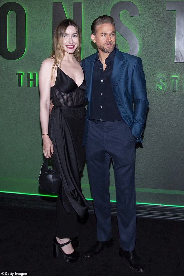 Charlie Hunnam was joined by his partner Morgana McNelis who wowed in a plunging black dress with mesh panelling
