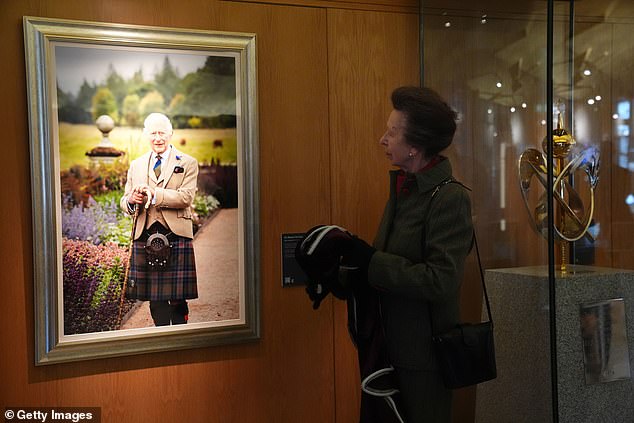 Princess Anne unveils a new portrait of King Charles III, taken by photographer Millie Pilkington, during a visit to the Scottish Parliament Building, Holyrood,  September 2025