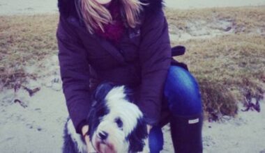 Pip Tomson always felt awkward admitting her Tibetan Terrier Billy (pictured together)  was a vegan but she said it helped save his life after his interest in regular meaty kibble declined