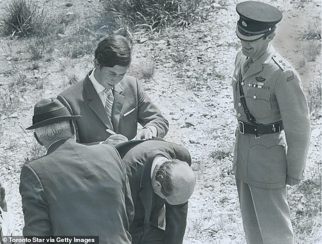 Sir Martin Charteris being used as a desk by Prince warned Charles's private secretary  to 'go steady on the Trust'