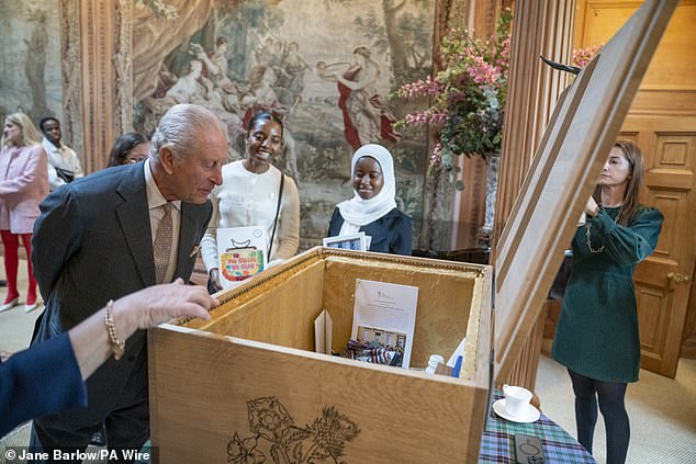 The King was also shown an acrylic painting of the gardens at Highgrove by the artist Jo Rance, and a hat made by the milliner Barnaby Horn