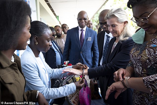 The Duchess of Edinburgh and Prime Minister of the Democratic Republic of Congo Judith Suminwa (right) view a stall and are given gifts at Kintambo General Hospital