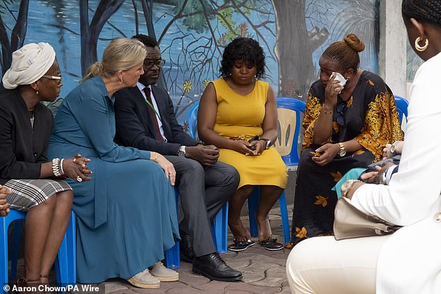 The Duchess of Edinburgh talks with people at the Makala Prison Safe House in Kinshasa