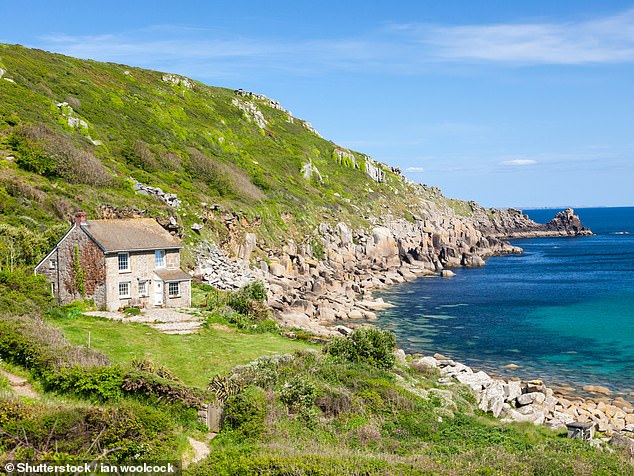 Don't give up on visiting Cornwall though, urges Lonely Planet's UK head Tom Hall, who says the region still has plenty to offer if you go in shoulder season. Pictured: Lamorna Cove in Cornwall