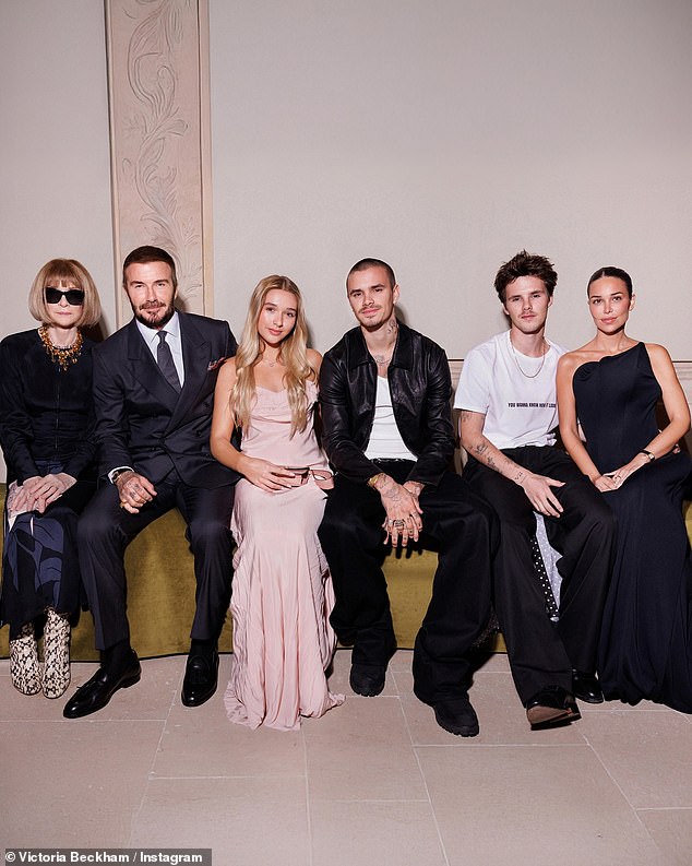 David Beckham has posted a gushing tribute to wife Victoria following her Paris Fashion Week show as the family sat united in the front row without Brooklyn